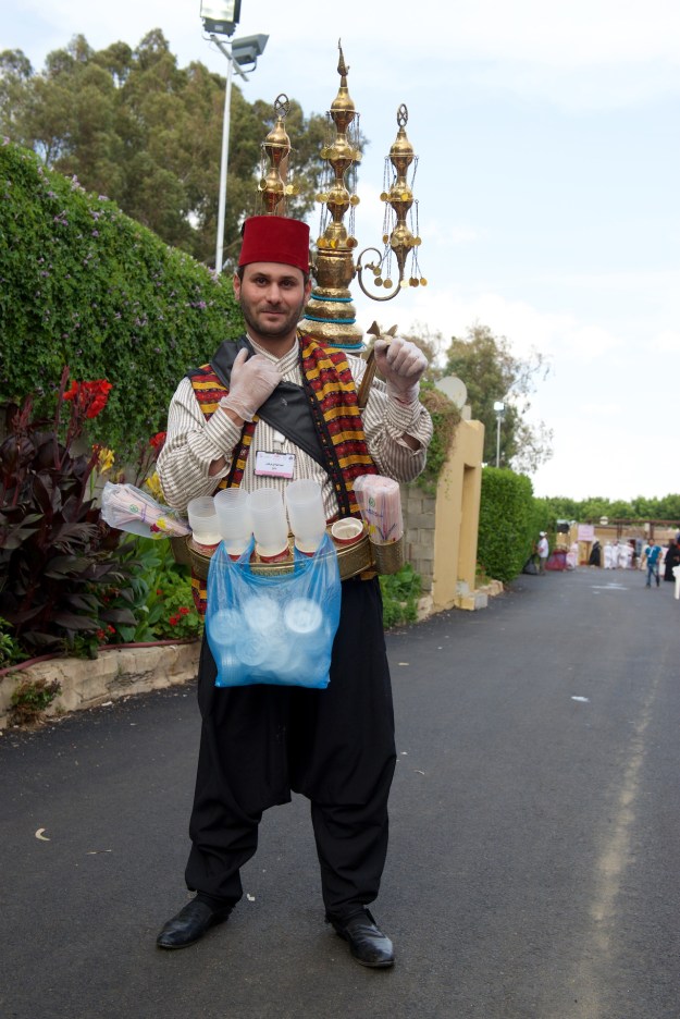 Juice seller in Turkish costume. They were everywhere when Fred was a child in Amman. This gentleman, in Taif, is updated with plastic gloves and disposable cups. The little cymbals let you hear him coming.